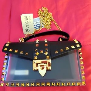 Clear/gold/black, crossbody/handheld purse. 🖤
